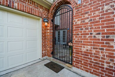 Driveway gate to charming courtyard!