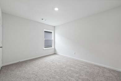 Unfurnished room with light carpet and recessed lighting