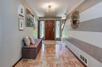 You are welcomed into the home via this spacious g