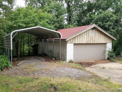 Good size 2 car garage/shop, 2 car carport and sto