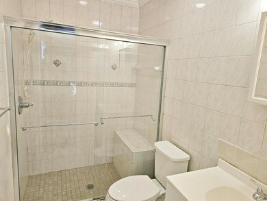 Master bathroom with tiled walk-in shower stall, t