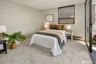 Sleeping area, and note one of the balcony doors to the right. On a nice evening you can enjoy the views.