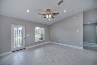 Unfurnished room featuring ceiling fan, lofted cei