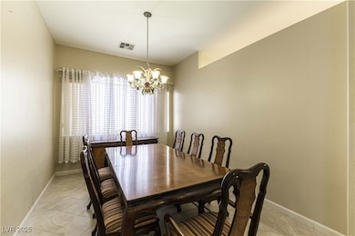 Dining area featuring light tile patterned floors,