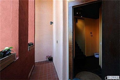 entry way with welcoming metal door opening to foy