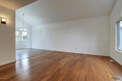 Formal living room is bright & airy