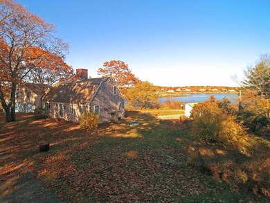 A long private driveway surrounded...