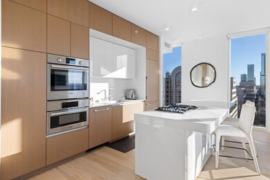 Kitchen with light countertops, light wood-style 