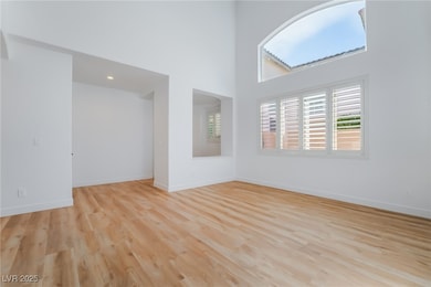 Unfurnished living room featuring light wood-style