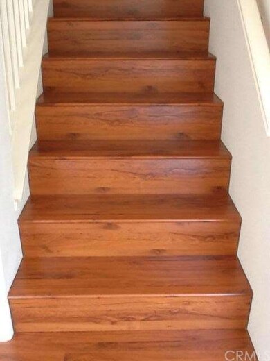 New laminate wood floors even on the stairs.