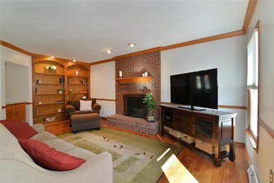 Built-in book cases, hardwood floors and a fireplace that can burn wood or continue to use the current gas logs.