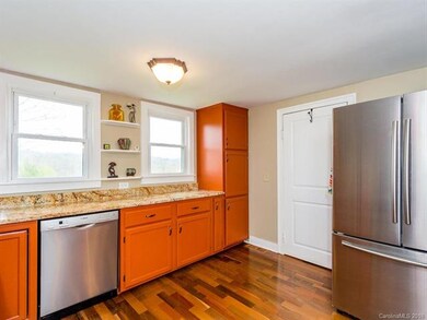 Natural light floods into the kitchen from the num