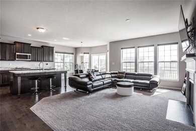 Beautiful open concept family room, kitchen and breakfast room, overlooking the large lake.