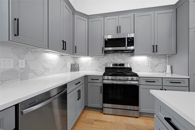 Custom cabinetry with elegant crown molding, soft-