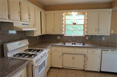 Kitchen with gas stove, lots of counter top space 