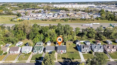 Aerial overview of property's location featuring nearby suburban area