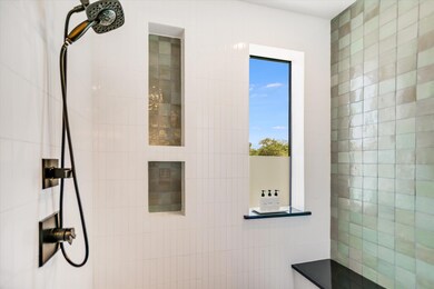 Full bathroom featuring tiled shower