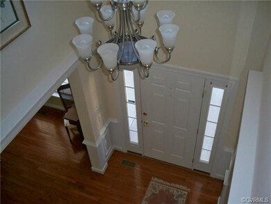 Looking down into foiyer from second floor loft ar