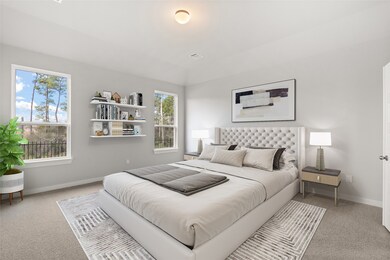 Come and unwind after a long day in this magnificent primary suite! This spacious room features plush carpet, warm paint, high ceilings and large windows.