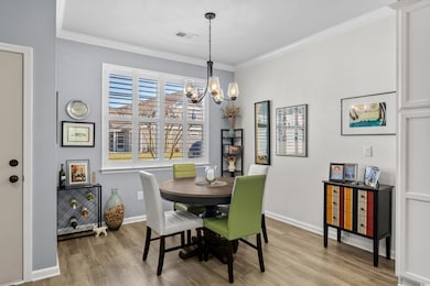 Dining space featuring visible vents, an inviting 