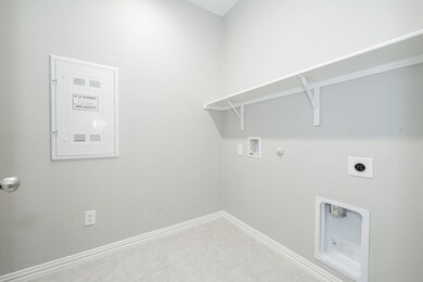 Washroom featuring gas dryer hookup, electric panel, electric dryer hookup, and washer hookup