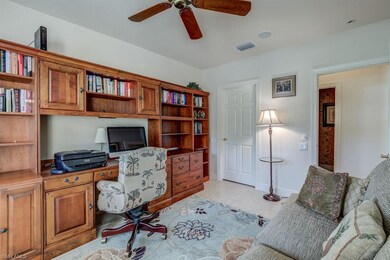 Den/office with large shelved storage closet