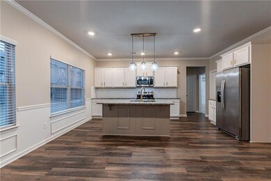 Kitchen with a center island with sink, appliances