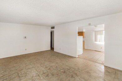 Living room looking into dining area