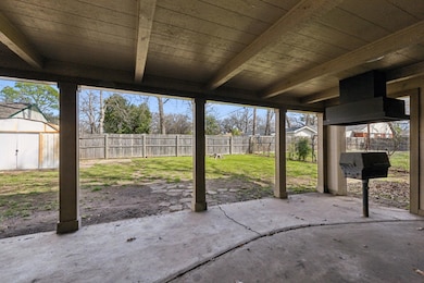 View of patio / terrace with an outbuilding, a sto