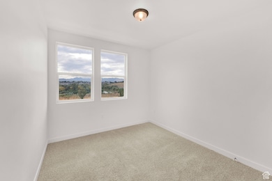 Unfurnished room with carpet flooring