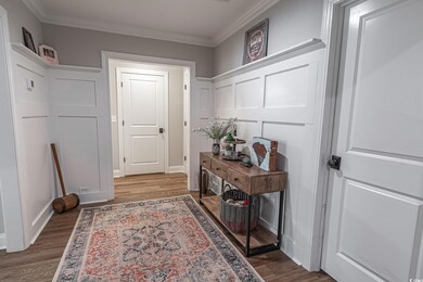 Doorway to outside featuring hardwood / wood-style