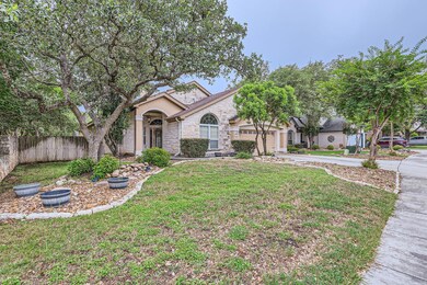 View of front facade featuring driveway, an attac