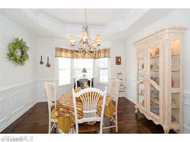 Dining Room. Spacious dining Room with Bay Window And elegant Trey Ceilings