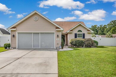 Single story home with a front yard
