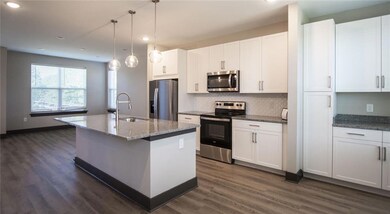 Kitchen with sink, dark hardwood / wood-style floo