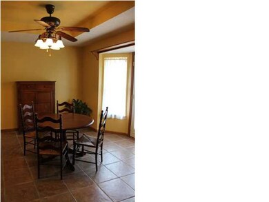 Large eating area in kitchen with door to go out o