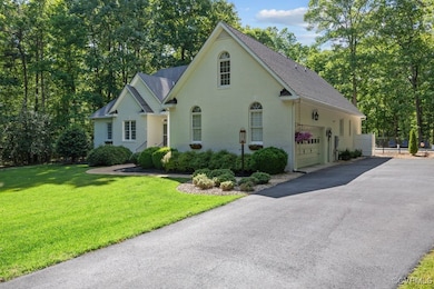View of front of property featuring a shingled roo