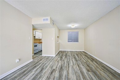 Living Room, Dining area and entrance to Kitchen.