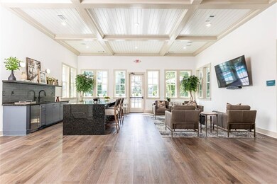 Living room featuring beam ceiling, crown molding, wood-type flooring, and coffered ceiling