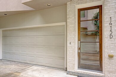 Spacious 2 car garage with a modern front door.