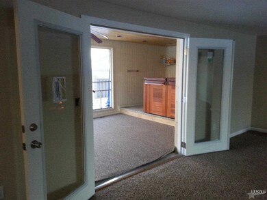 Open the French Doors to the screen room.