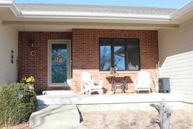 Front of House with roomy porch and new rock lands