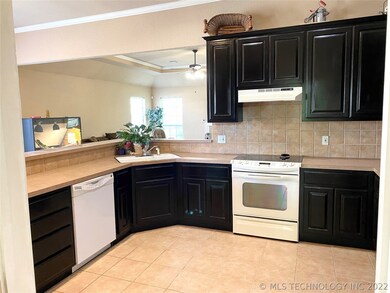 Open kitchen concept with updated cabinets.