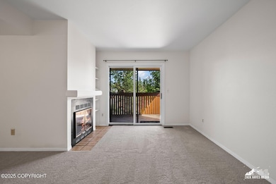 Living, doors to balcony and FP