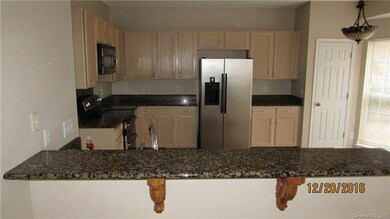 VIEW OF THE KITCHEN FROM THE FAMILY ROOM