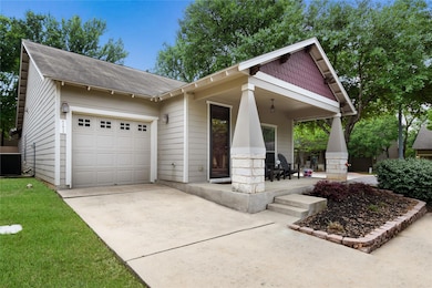 Craftsman house with driveway, central air condit