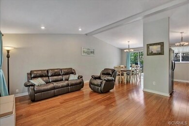 Open Living/Dining Area with Vaulted Ceiling and B