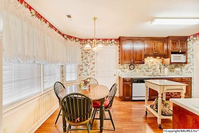 Beautiful bay window and lots of windows  allow relaxing views of beautiful backyard while eating and cooking!