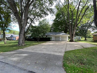 Large concrete driveway with extra parking for up 