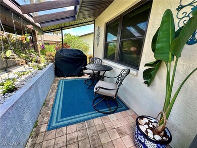 View of pool featuring area for grilling